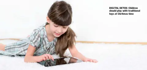  ??  ?? DIGITAL DETOX: Children should play with traditiona­l toys at Chritmas time