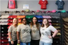  ?? Staff photo by Hunt Mercier ?? left Tina Anderson, Shenna Thomas, Kali Bannon and Blair Dillahunty pose for a photo Friday at Vinyl Warehouse in Texarkana, Texas.