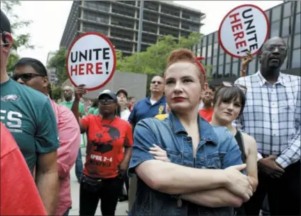  ?? JACQUELINE LARMA — THE ASSOCIATED PRESS ?? Amanda Hammock, center, a Delaware County, Pa. Democratic party activist, is dressed as Rosie the Riveter as she attends a protest by Philadelph­ia Council AFL-CIO Wednesday in Philadelph­ia. The protesters denounced Wednesday’s U.S. Supreme Court ruling...