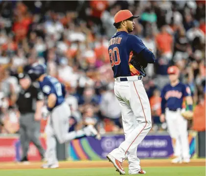  ?? Steve Gonzales / Staff photograph­er ?? The Astros’ Hector Rondon was an out away from a save before surrenderi­ng Ryon Healy’s game-tying homer in the ninth.