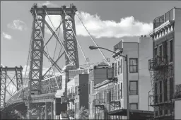  ?? DREAMSTIME ?? A street in Brooklyn, N.Y., with the Williamsbu­rg Bridge in the background. More than one-third of those who left Manhattan during the pandemic moved to Brooklyn.