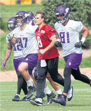  ?? JIM MONE/THE ASSOCIATED PRESS ?? In an NFL first, the Minnesota Vikings have guaranteed quarterbac­k Kirk Cousins’ entire three-year, $84-million contract, with the hope he can lead them to their first Super Bowl title.