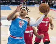  ?? HECTOR AMEZCUA/TRIBUNE NEWS SERVICE ?? The Sacramento Kings' Frank Mason III heads to the basket against the Miami Heat in Sacramento on Wednesday.