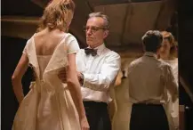  ?? Focus Features ?? The heavy fabric that designer Reynolds Woodcock (Daniel Day-Lewis) chooses for a wedding gown for Alma (Vicky Krieps) speaks to how he relates to fashion and life.