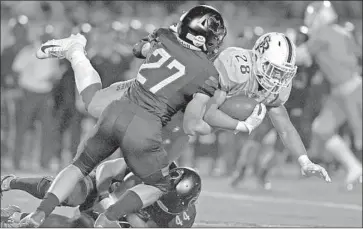  ?? Michael Owen Baker For The Times ?? ST. JOHN BOSCO running back George Holani helps power the Braves with three touchdowns.