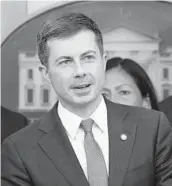  ?? SUSAN WALSH/AP ?? Transporta­tion Secretary Pete Buttigieg speaks Monday at a White House briefing on the six-month anniversar­y of the bipartisan infrastruc­ture law.