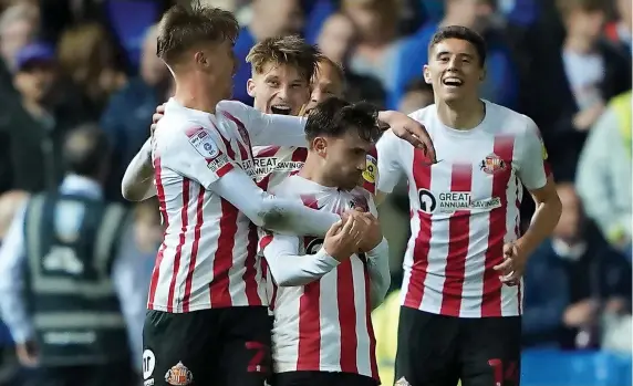  ?? Picture: Zac Goodwin/PA ?? Sunderland players mob Patrick Roberts, centre, after he scored against Sheffield Wednesday