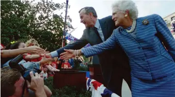  ??  ?? File photo shows former President George Bush and First Lady Barbara Bush shake hands with members of the crowd at a ‘Bush/Quayle 92’ rally on the steps of the Mississipp­i State Capitol. — AFP photo