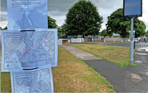  ?? ?? A notice outside the entrance to Bournside School about plans to add more double yellow lines in Warden Hill Road