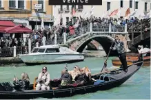  ?? REUTERS ?? PEOPLE protest against the introducti­on of the registrati­on and tourist fee to visit Venice this week. Venice began charging day trippers for entry, a world first aimed at easing pressure on the Italian lagoon city drowning under the weight of mass tourism. Day visitors will have to buy a five-euro (R100) ticket, monitored by inspectors carrying out spot checks at key points in the Unesco World Heritage site. |