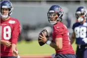  ?? DAVID J. PHILLIP/AP ?? Texans QB C.J. Stroud, the No. 2 overall draft pick last month, looks to throw during an organized team activity Tuesday in Houston. Stroud threw for 8,123 yards with 85 TDS and 12 intercepti­ons at Ohio State.