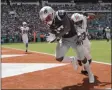  ?? LYNNE SLADKY - THE ASSOCIATED PRESS ?? New England Patriots wide receiver Antonio Brown (17) scores a touchdown as Miami Dolphins cornerback Jomal Wiltz (33) attempts to defend, during the first half at an NFL football game, Sunday, Sept. 15, 2019, in Miami Gardens, Fla.