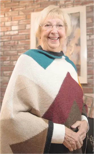  ?? PHOTOS: ARYN TOOMBS/ CALGARY HERALD ?? Doreen Kot in a handcrafte­d sweater made for Minkha Sweaters, which started in 1992 after a trip to Bolivia. Minkha means “women working together.”