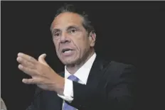  ?? RICHARD DREW
AP PHOTO/ ?? New York Gov. Andrew Cuomo speaks during a news conference at New York’s Yankee Stadium, Monday, July 26. Members of New York’s ethics commission have voted overwhelmi­ngly to rescind approval of Cuomo’s $5.1 million book deal Nov. 16.