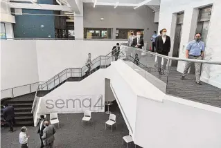  ?? Hearst Connecticu­t Media file photo ?? Elected officials take a tour of genomic testing firm Sema4’s lab at 62 Southfield Ave., Stamford, on Sept. 18, 2020. The company, now known as GeneDx, reported nearly 700 layoffs to the Connecticu­t Department of Labor in 2022.