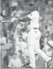  ?? Ezra Shaw / Getty Images ?? The Dodgers’ Yasiel Puig takes a moment to admire his handiwork — a home run in the bottom of the seventh inning off the Cubs’ Michael Montgomery.