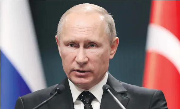  ??  ?? Russian President Vladimir Putin says surging global markets reflect confidence in U.S. President Donald Trump’s economic course.