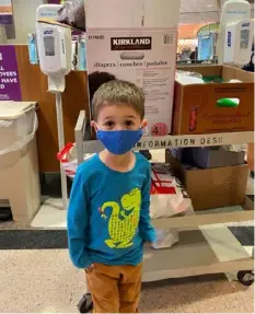  ??  ?? Bennett Teacoach, 3, of Marshall, helped fill and deliver 300 treat baggies to front-line workers at UPMC Passavant and other places with his mom, Cami Teacoach, for a VolunTOTS project in March.