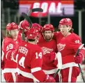  ?? PAUL SANCYA — THE ASSOCIATED PRESS ?? Detroit Red
Wings center Dylan Larkin, second from right, celebrates his goal with teammates against the New York Islanders in the second period of Tuesday’s game in Detroit.