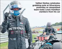  ??  ?? Valtteri Bottas celebrates grabbing pole at Silverston­e
yesterday as vanquished team-mate Lewis Hamilton
clambers from his car