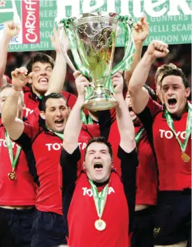  ??  ?? CARDIFF: This file photo taken on May 20, 2006 shows Anthony Foley (C-bottom), then Munster captain holding the Heineken Cup European final trophy at the Millennium Stadium in Cardiff. Munster head coach Anthony Foley died suddenly in Paris on October...
