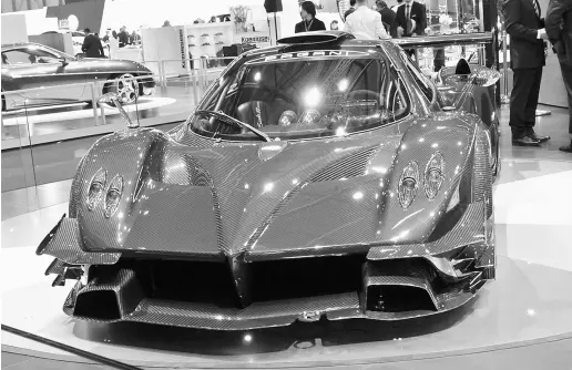  ?? Alexandra Straub / Postmedia News ?? The Pagani Zonda Revolucion is one of many über-expensive supercars for the über-rich at this year’s Geneva Motor Show.