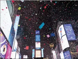  ?? ?? Confetti falls at midnight on the Times Square New Year’s celebratio­n in New York.