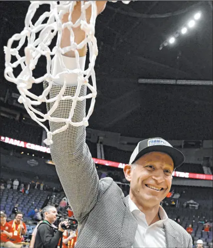  ?? John Amis The Associated Press ?? Alabama coach Nate Oats cut down the nets at the Southeaste­rn Conference tournament Sunday. He’s hoping for another such ceremony in a few weeks at the Final Four in Houston.