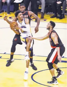  ?? Scott Strazzante / The Chronicle ?? Patrick McCaw goes up for a shot against Portland’s Evan Turner in the second quarter during Game 2 at Oracle Arena. McCaw was filling in as a starter for Kevin Durant.