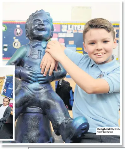  ??  ?? Delighted Olly Reilly with the statue