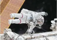  ?? NASA via AP ?? Expedition 46 Commander Scott Kelly participat­es in a spacewalk outside the Internatio­nal Space Station.