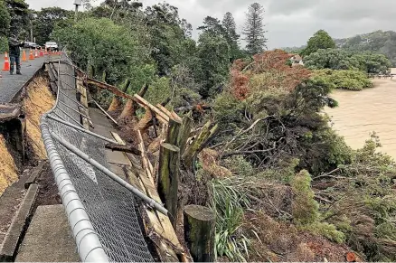  ?? JAN DIPROSE/SUPPLIED ?? Herald Island’s Twin Wharf Rd after Cyclone Gabrielle.