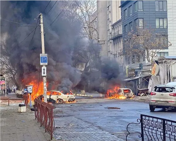  ?? Photo: Reuters ?? Cars burn on a street after a Russian military strike, amid Russia’s attack of Ukraine, in Kherson, Ukraine on December 24, 2022.