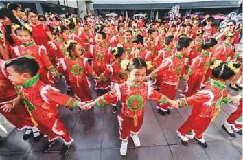  ?? Antonin Kélian Kallouche/Gulf News ?? Children perform during the Chinese New Year parade at City Walk in Dubai yesterday. The parade was split into sections with each group and performanc­e representi­ng a province of China.