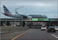  ?? NAM Y. HUH - THE ASSOCIATED PRESS FILE PHOTO ?? In this Nov. 27, 2019, file photo an American Airlines flight arrives at O’Hare airport in Chicago.