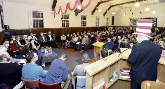  ?? PHOTO: GERARD O’BRIEN ?? Not kitten around . . . Phil Somerville (right), dressed in his Cat in the Hat attire, addresses a full hall at the Opoho candidates forum on Sunday night.