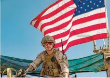  ?? — AFP ?? A soldier sits on top of a US military vehicle passing through the Syrian northeaste­rn town of Qahtaniyah on the border with Turkey on Thursday.