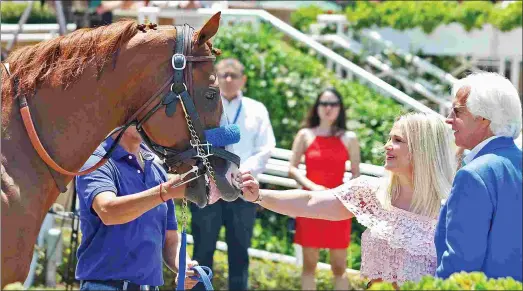  ?? EMILY SHIELDS ?? Bob Baffert and his wife, Jill, greet Triple Crown winner Justify on June 23, when the colt was paraded at Santa Anita.