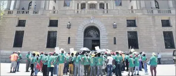  ?? PHOTO: PHILL MAGAKOE ?? Protesters outside the National Treasury in this file photo. The recent rally in commodity prices, and the forecast by Standard Bank Research that GDP growth may accelerate to 1.4 percent this year, will allow the Treasury more room to manoeuvre and...