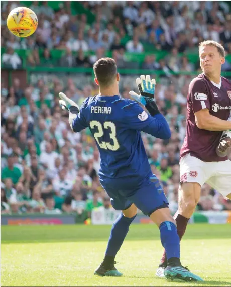  ??  ?? Celtic striker Vakoun Bayo forced Hearts captain Christophe Berra into an error that led to the game’s opening