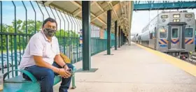  ?? JERRY JACKSON/BALTIMORE SUN ?? Premal Shah, who works for the U.S. Department of Veterans Affairs, waits to board a MARC train in Halethorpe for his first train commute in over a year.