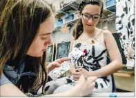  ?? SUBMITTED ?? Liberty Dickson, left, theater-apprentice student at the Blackbird Academy of Arts, paints a Jackson Pollock costume on Emily Hede for her appearance in Museum Alive. The all-academy production alludes to several famous paintings, including one by...