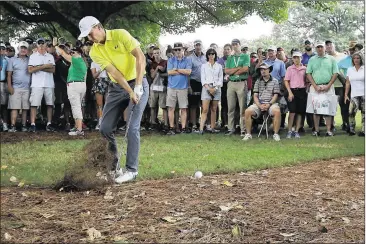  ?? CURTIS COMPTON / CCOMPTON@AJC.COM ?? Jordan Spieth plays out of the trees toward the fifth green Thursday in the Tour Championsh­ip at East Lake. “We were both on the grind a little bit,” Spieth said of his round with pal Justin Thomas.