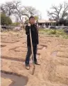  ?? COURTESY OF UNIVERSITY OF NEW MEXICO PRESS ?? Roxanne Swentzell is shown irrigating her field in 2014.