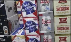  ??  ?? In this Nov. 8 file photo, cases of Pabst Blue Ribbon and Coors Light are stacked next to each other in a Milwaukee liquor store. AP PHOTO/IVAN MORENO