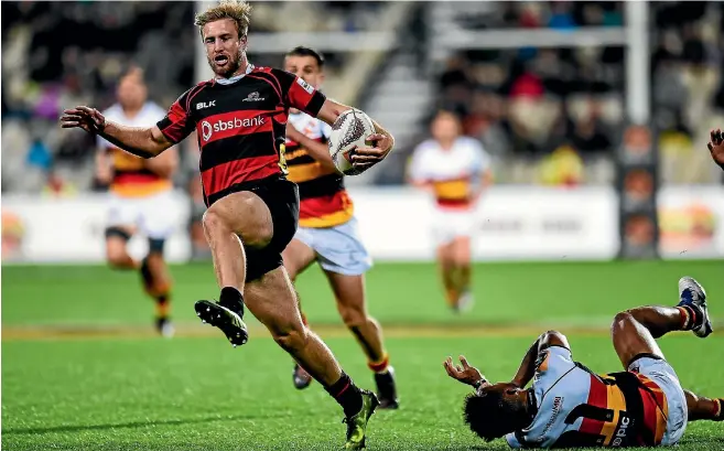  ?? PHOTOSPORT ?? Canterbury wing Braydon Ennor skips clear of the Waikato defence in Christchur­ch last night.