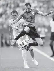  ?? AFP ?? Portugal superstar Cristiano Ronaldo (left) is well acquainted with Uruguay defender Diego Godin from their Madrid derby encounters in La Liga. The pair will renew their rivalry in an eagerly anticipate­d World Cup last-16 clash in Sochi on Saturday.