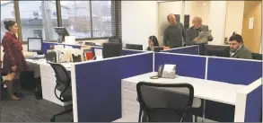  ??  ?? The buzz in our new newsroom. From the left, reporter Katrina Koerting, Assistant Managing Editor Keila Torres, reporter Rob Ryser, Managing Editor John Alcott and reporter Zach Murdock.