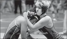  ?? AP/Houston Chronicle/MELISSA PHILLIP ?? Mack Beggs (right), a transgende­r boy, won the Texas state girls wrestling title Saturday. State policy calls for students to wrestle against the gender listed on their birth certificat­es.