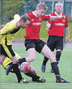  ??  ?? Andy Maclean in midfield action as Newshot players try to keep him from reaching their goalmouth.